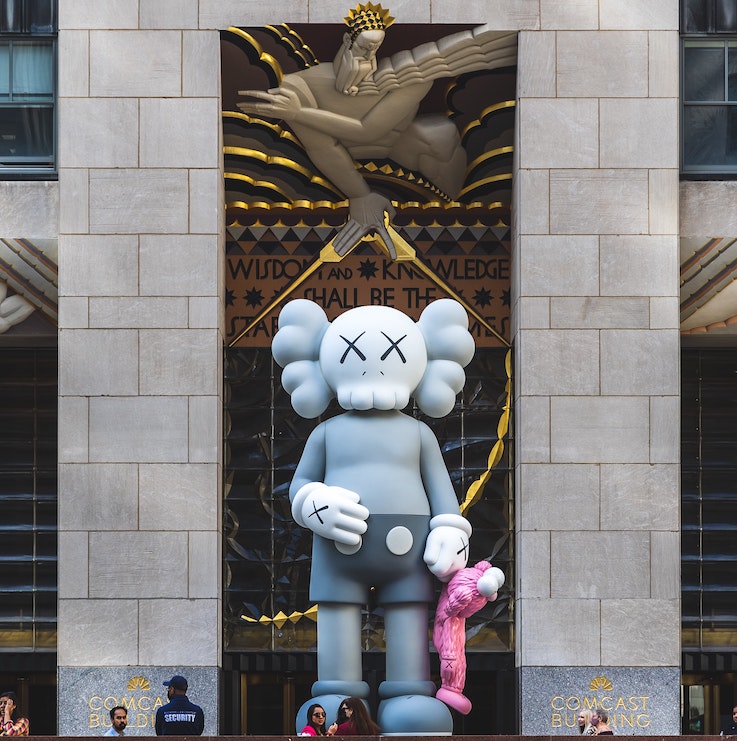 Art toys KAWS statue at Rockefeller center